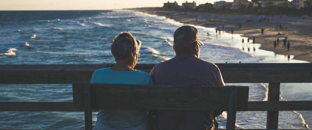 A happy couple enjoying their retirement, smiling and looking content