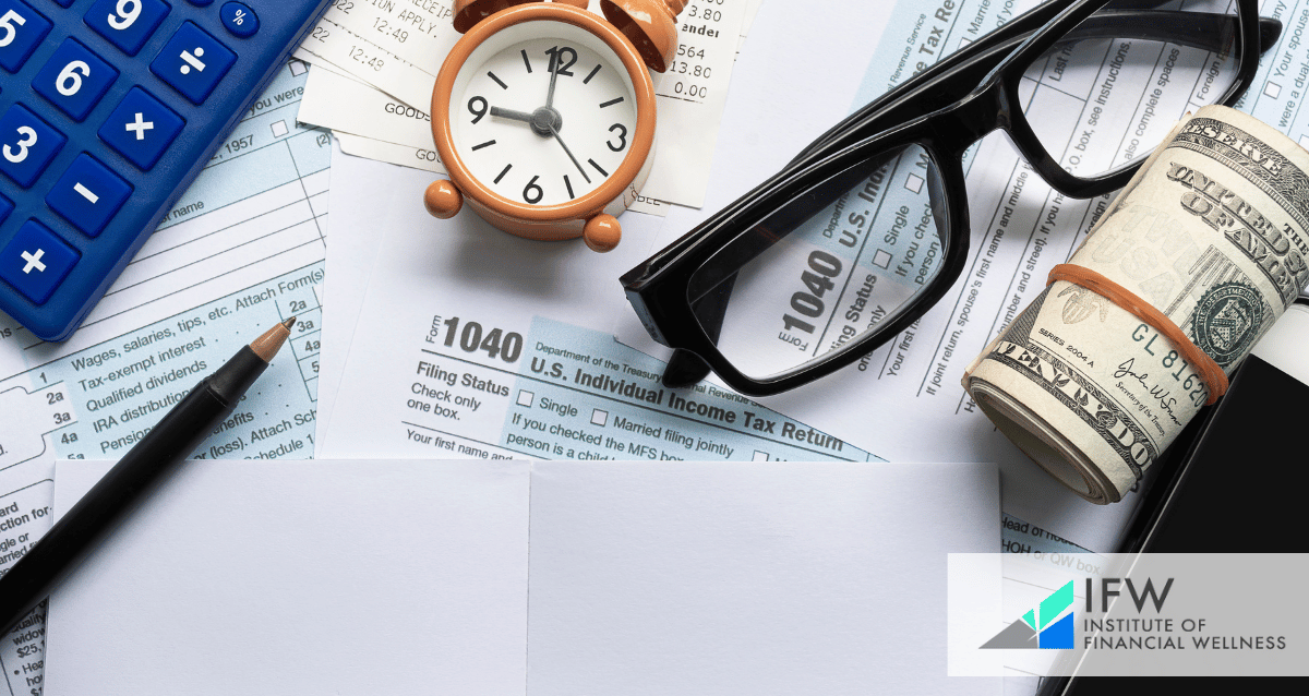 An image with tax forms, a calculator, glasses and dollar bills