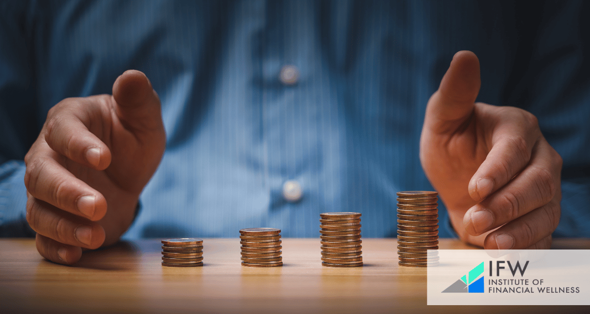 A person at a table with towers of coins